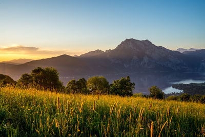 Scenic view of land against sky during sunset