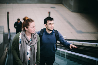 Young couple standing on steps