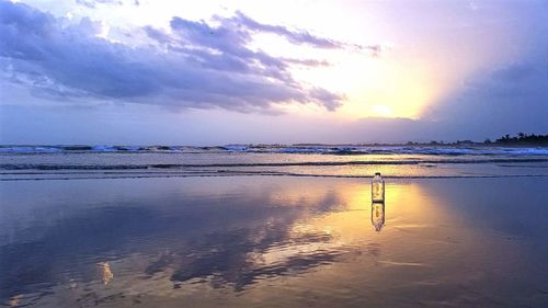 Scenic view of sea against sky at sunset