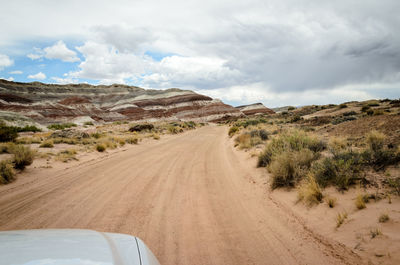 Dirt road passing through a desert