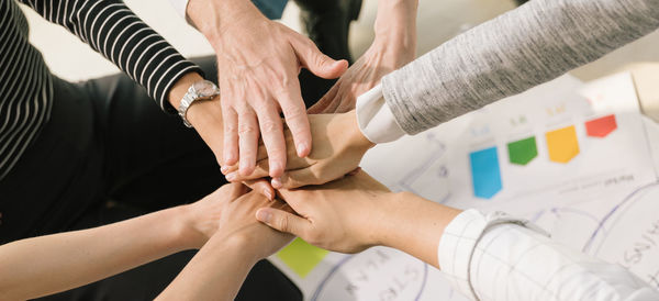 High angle view of people hands