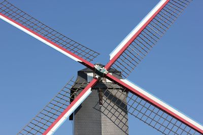 Low angle view of traditional windmill against clear sky