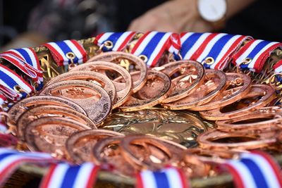 Close-up of gold medals container