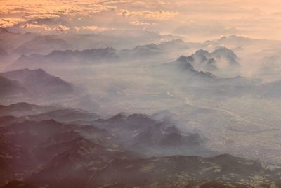 Scenic view of mountains against sky during sunset