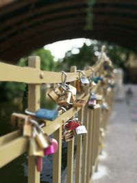 Close-up of padlocks on metallic railing