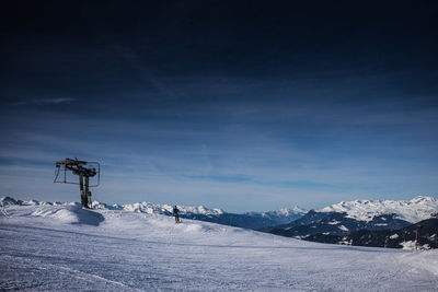 Scenic view of mountains against cloudy sky