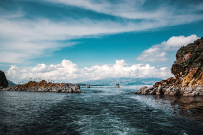 Scenic view of sea against cloudy sky