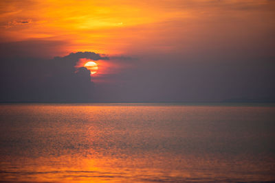 Scenic view of sea against romantic sky at sunset