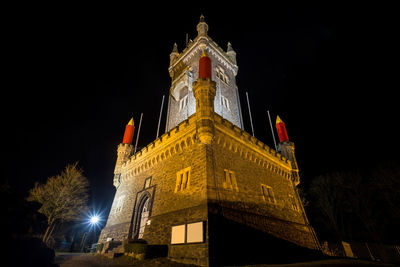 Low angle view of illuminated historical building at night