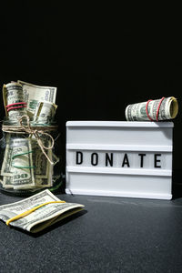 Close-up of stack of objects against black background