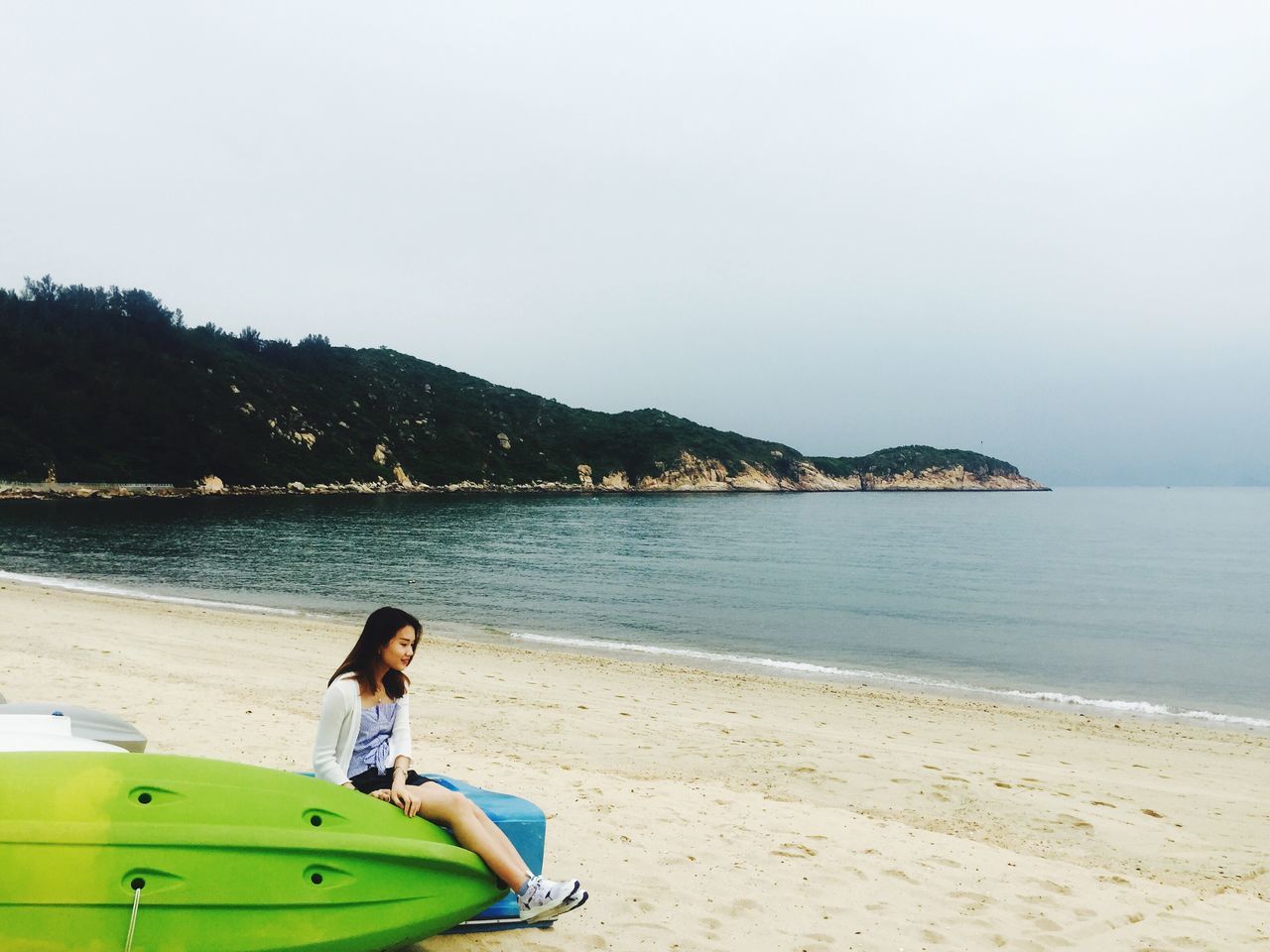 beach, one person, real people, sea, casual clothing, young adult, sand, outdoors, vacations, day, young women, standing, water, nature, clear sky, full length, mountain, sky, people