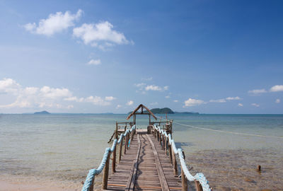 Pier over sea against sky