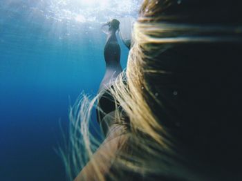 Close-up of woman swimming undersea