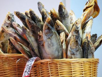 Close-up of dry fish in basket for sale