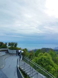 High angle view of trees by sea against sky