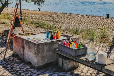 Multi colored chairs on table at beach