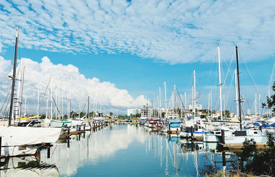 Boats moored at harbor