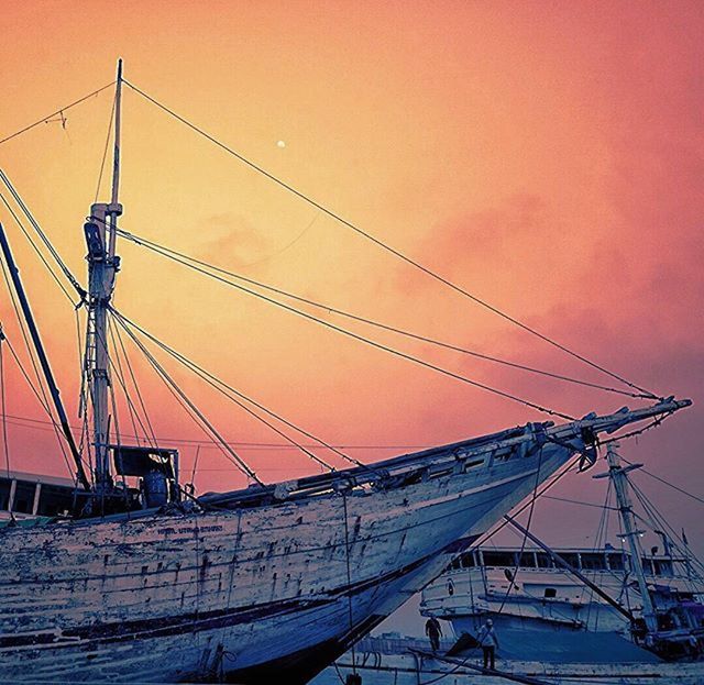 sunset, mast, sky, nautical vessel, built structure, development, construction site, architecture, crane - construction machinery, low angle view, transportation, crane, boat, construction, connection, orange color, sailboat, outdoors, sea, harbor