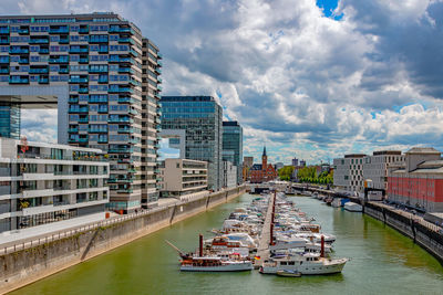 Panoramic view of river and buildings against sky