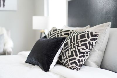 Close-up of pillows on bed at home