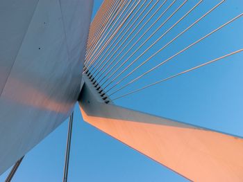 Low angle view of bridge against clear blue sky