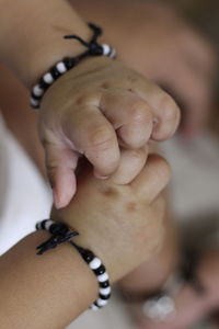 Close-up of woman holding hands