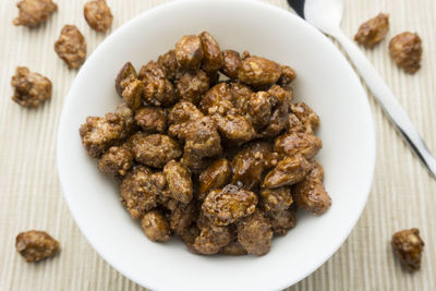 Close-up of roasted almonds in plate at table