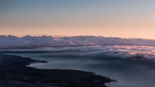 Scenic view of lake against sky during sunset