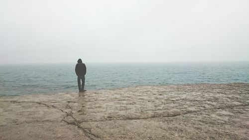 Woman standing on beach