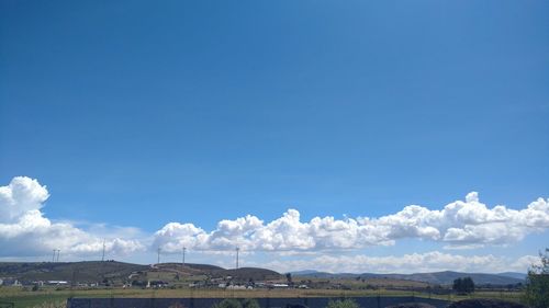 Scenic view of landscape against blue sky