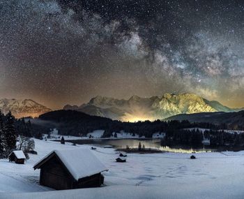 Scenic view of mountains against sky at night