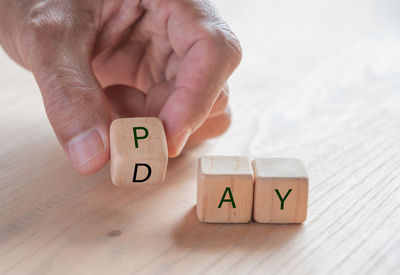 Baby hand with toy on table