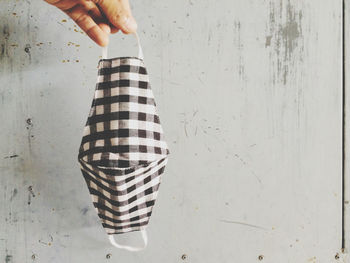 Midsection of woman holding umbrella