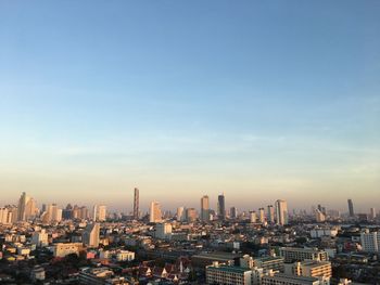 Aerial view of modern buildings in city against sky