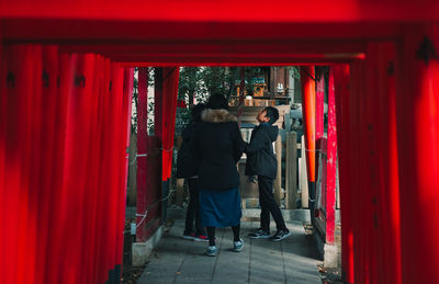 People walking on red walkway