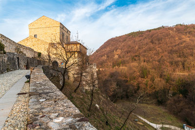 Sunset on the ancient castle of ragogna, italy. fortress guarding the ford on the river tagliamento