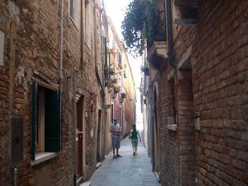 Narrow alley along buildings