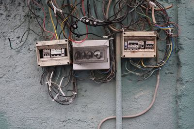 Close-up of telephone booth on wall