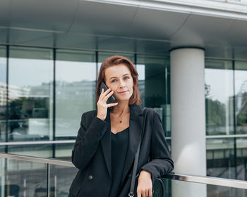 Young businesswoman talking on mobile phone