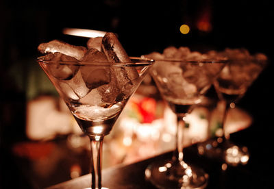 Close-up of ice cubes in martini glass at nightclub