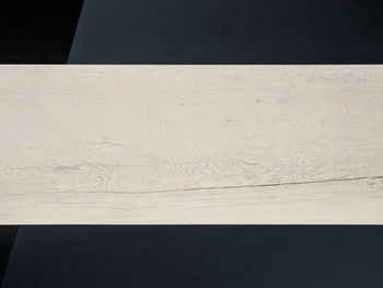 High angle view of wooden table against black background