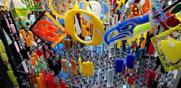 Close-up of multi colored clothes hanging on clothesline