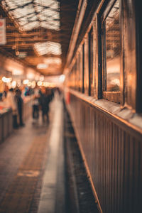 People walking on railroad station platform