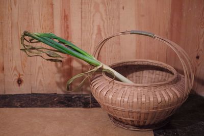 High angle view of scallion in wicker container at home