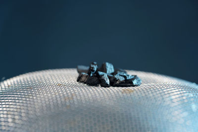 Close-up of crab on table against black background