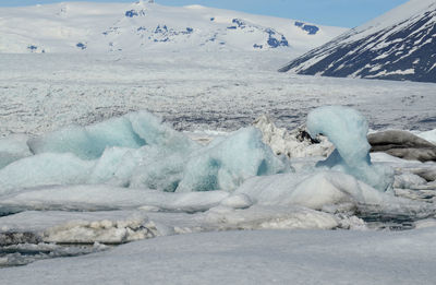 Gorgeous scenic view of blue ice on a glacier in iceland in a stunning landscape.