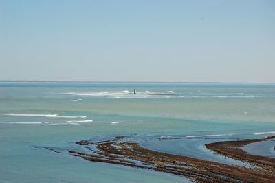 Scenic view of beach against clear sky