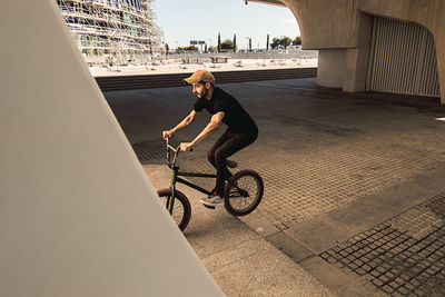 Man riding bicycle on street