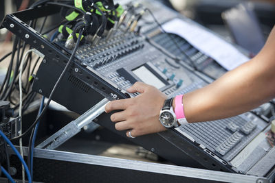 Cropped hand of person playing dj