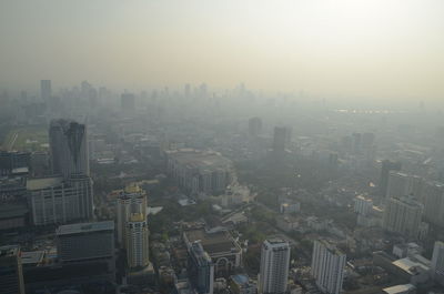 High angle view of buildings in city against sky